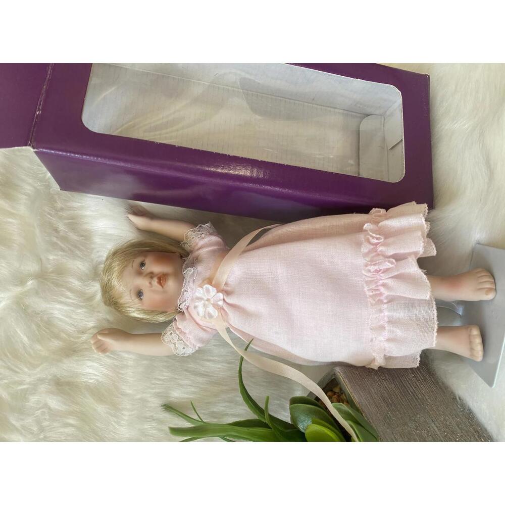 Collectible Porcelain Baby Doll in Pink Dress